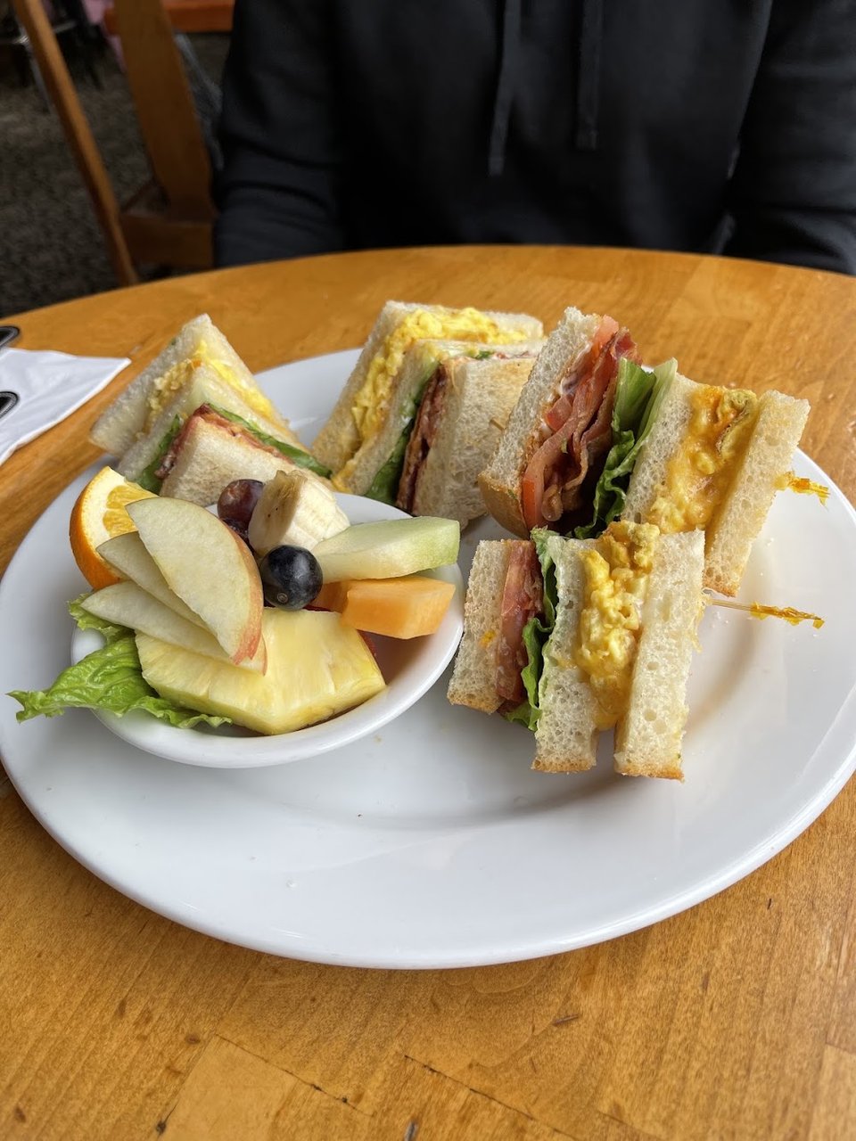 Printed menu with sandwiches, salads, and grilled fish.