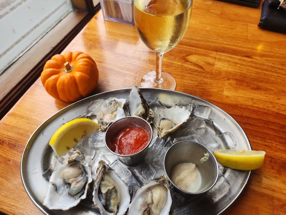 Restaurant menu showing beverages and seafood selections.